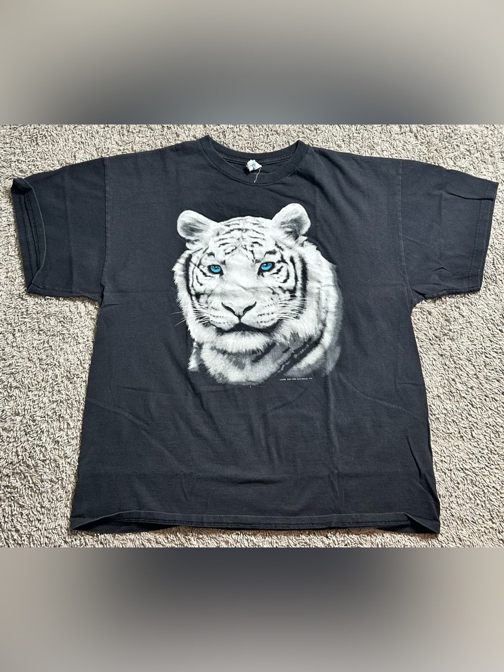 Delta Black Tee with White Tiger and Blue Eyes